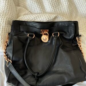 Michael Kors rose gold hardware handbag